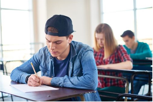 Image of teenage boy sitting leaving cert mock exam.